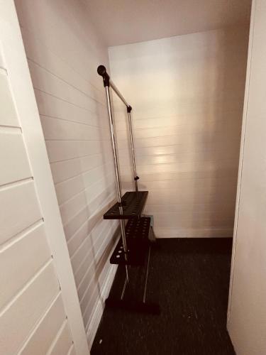 a hallway with a stair case in a room at Cham Crest in Friern Barnet