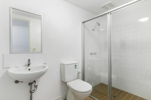 a bathroom with a toilet and a sink and a shower at Murdoch University Village in Perth