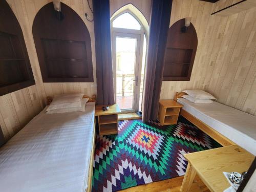 an overhead view of a room with two beds at Khiva Siyovush Hotel in Khiva