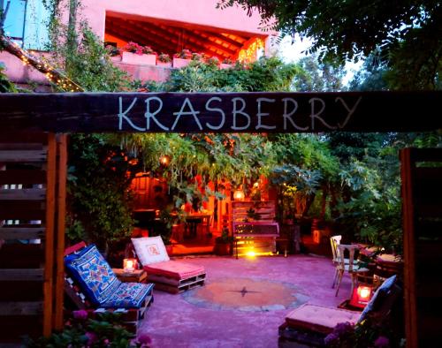 a backyard with chairs and a sign that reads racism at Krasberry Ježev brlog in Komen