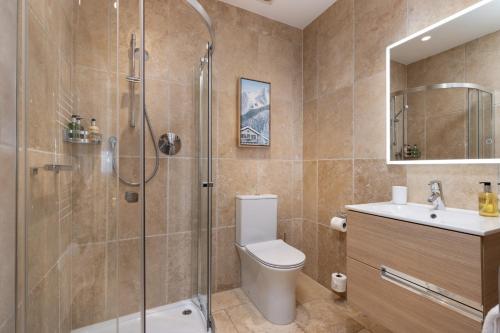 a bathroom with a shower and a toilet and a sink at The Ford Apartment in Perth