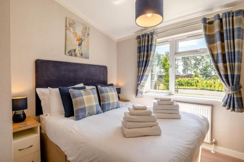 a bedroom with a bed with towels on it at 3 Bed in York oc-90401 in Riccall