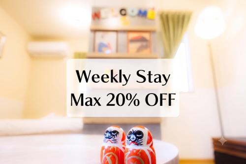 a pair of shoes with the words weekly stay may off at 新大阪旅庵 民泊縁家 Enya-Japanese Townhouse 3min to Higashi-Mikuni Station Near Shin-Osaka in Osaka