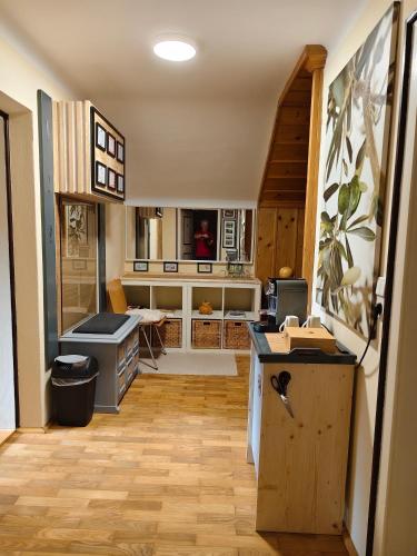 a kitchen with wooden floors and a counter top at By Wallner's in Sankt Leonhard