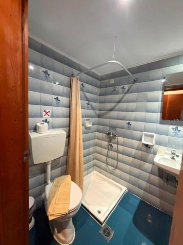 a bathroom with a toilet and a sink at Afandou Mare in Afantou