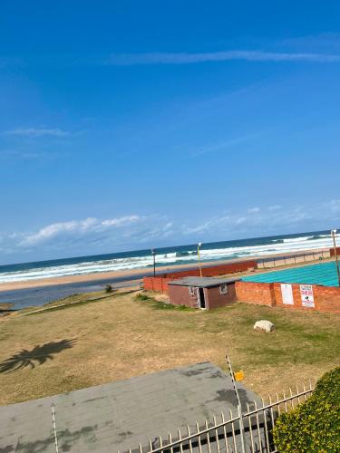 a view of a beach with the ocean in the background at Margate Boulevard - Seaview Apartment in Margate