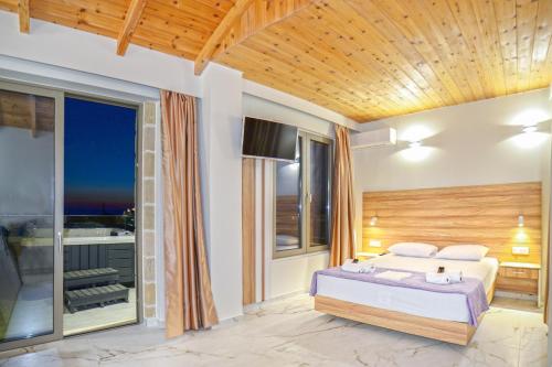 a bedroom with a bed and a balcony at Faros Elafonisi in Elafonisi