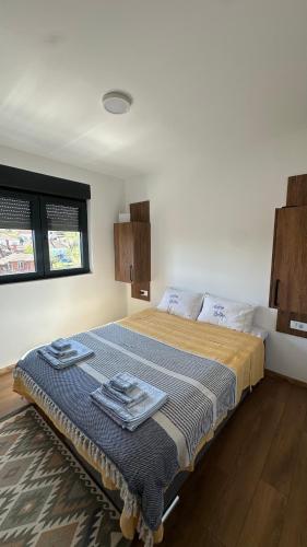 a bedroom with a large bed in a room at Eirene Residence in Vrnjačka Banja