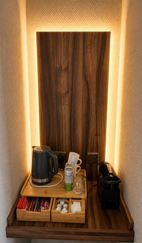 a table with a coffee maker on top of it at Hedley House Hotel Wellness and Spa in York