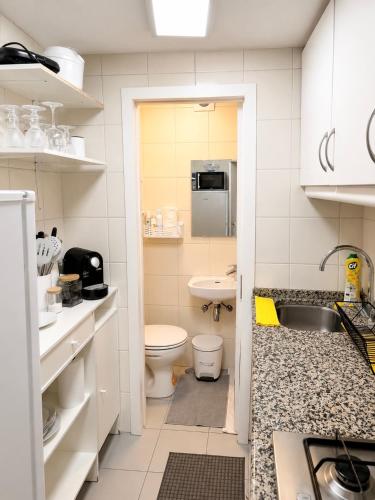 a small bathroom with a toilet and a sink at Central Lisbon Apartment Santos Walk to Cais do Sodré in Lisbon