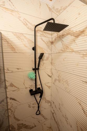 a shower in the corner of a room at Villa MaLea in Neum