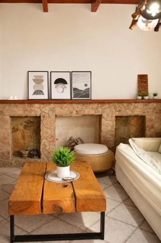 a living room with a table and a fireplace at Caelum House Familiar Con Cochera in Rafaela
