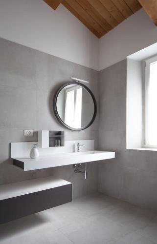 a bathroom with a sink and a mirror at Agriturismo Casacarella in Cesena