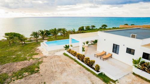an aerial view of a house with a swimming pool at Villa Kweli - Private Ocean Front Villa in Tongoni