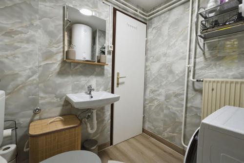 a bathroom with a sink and a toilet and a shower at Apartment Vineyard nook Lendava in Lendava