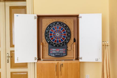 a dart board in a wall in a room at Penzión - Restaurant Atrium in Poprad
