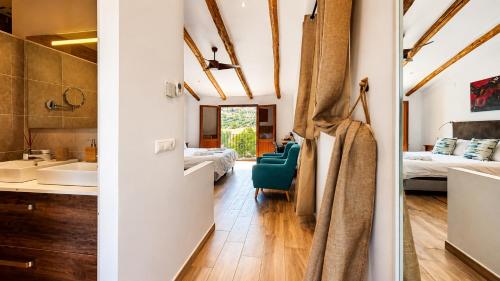 a room with a sink and a bathroom with a bedroom at Lemon Tree Retreat at El Amparo in Alhama de Granada