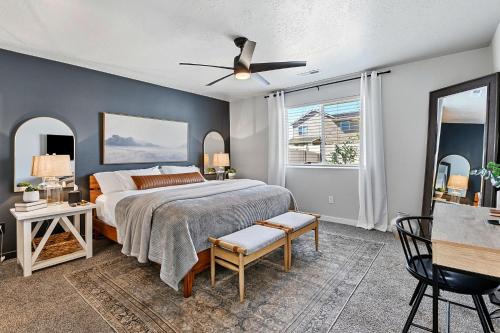 a bedroom with a bed and a ceiling fan at Mineral Spa Fire Pit Game Room Mini Split AC in Meridian