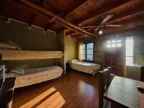 a room with two bunk beds and a table at Finistterra in Tanti