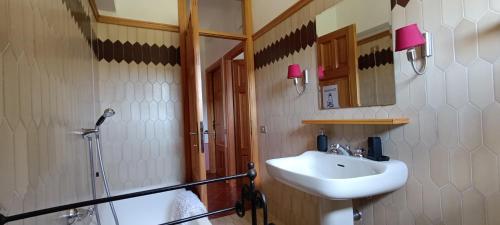 a bathroom with a sink and a shower at Country Hill B&B in Arezzo