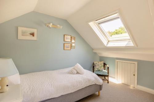 a bedroom with a bed and a window at 3 Bed in Bridport oc-dc160 in Bridport