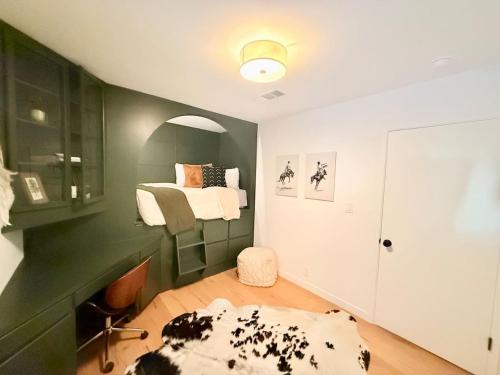 a bedroom with a bed in a green wall at Lavender House and Guest House in Ojai