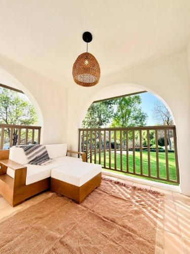 a living room with a couch and a large window at Lavender House and Guest House in Ojai