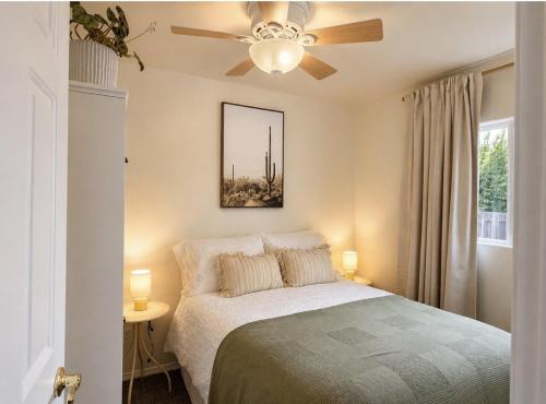 a bedroom with a bed and a ceiling fan at Ojai Pixie House in Ojai