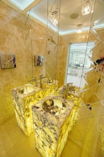 a bathroom with two sinks and a mirror at Harmony Suites - Dream Island in Sunny Beach