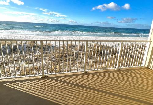 a balcony with a view of the beach at Cabana Club 206, Beachfront,Gulf view, King Bed, private beach in Destin