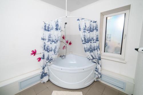 a bathroom with a toilet and a window at Teremok in Dimitrovgrad