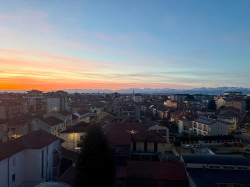 a view of a city at sunset at SNG - Paggi 78 in Vercelli