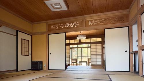an empty room with doors open to at Hourokusha - Vacation STAY 13417 in Doji