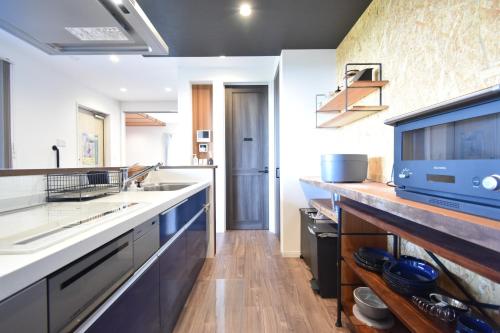 a kitchen with a sink and a counter at The Wave - Vacation STAY 62368v in Hokota