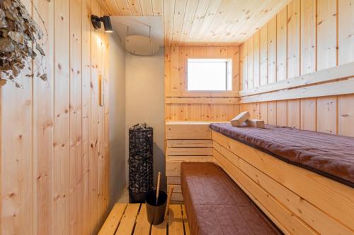 a room with a bench in a wooden cabin at The Wave - Vacation STAY 62368v in Hokota