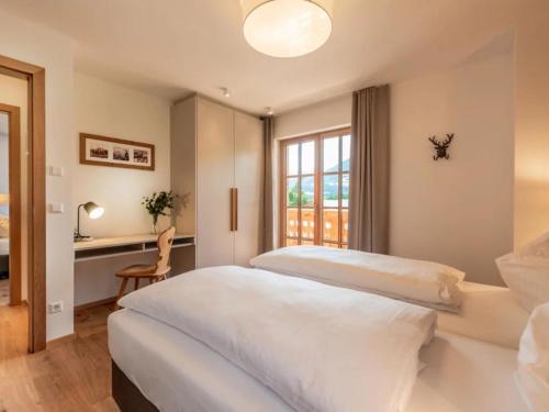 a bedroom with two white beds and a window at Chalet Jona in Sonnberg