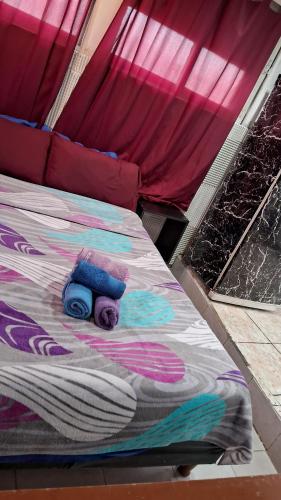 a bed with a teddy bear on top of it at Che Lolita house 4 in Buenos Aires