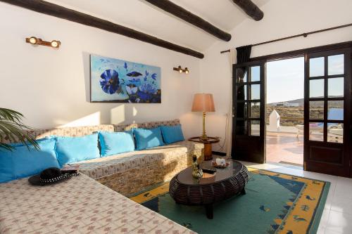 a living room with a couch and a table at Clara Suite 3 - Macaronesiahomes in Conil