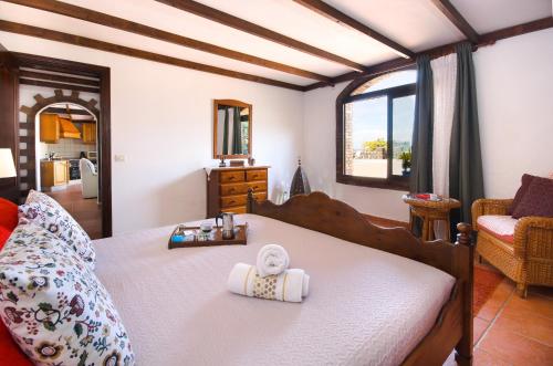 a bedroom with a bed with two towels on it at Clara Suite 1 - Macaronesiahomes in Conil