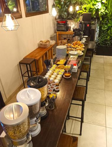 a long table with many plates of food on it at Huella Andina in San Carlos de Bariloche
