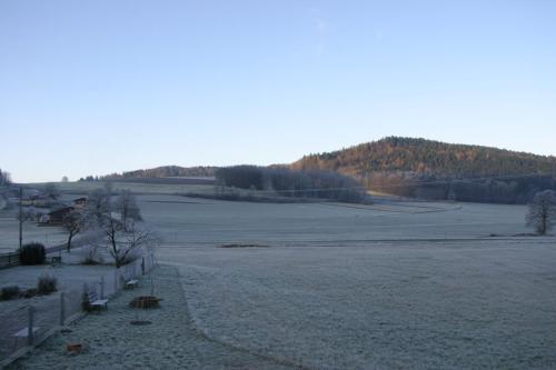 a large field with a fence in the middle of it at Haus am Treffenbach in Waldmünchen