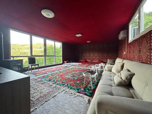 a living room with a couch and a rug at Happy House in Sarajevo