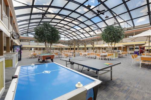 a building with two ping pong tables and chairs at Best Western Plus Dubuque Hotel and Conference Center in Dubuque
