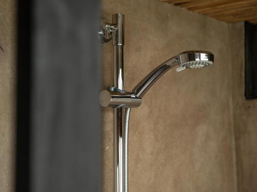 a shower with a shower head in a bathroom at Lost Cabin - Vacation STAY 89724v in Kamogawa