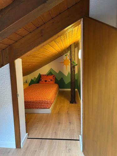 a bedroom with a bed in a small room at Ovronnaz , 2 pièces appartement Marana in Ovronnaz