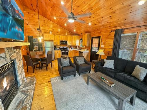 a living room with a couch and a fireplace at Free Railroad Tix - secluded - Fire Pit and Outdoor Bed Swing in Talc Mountain