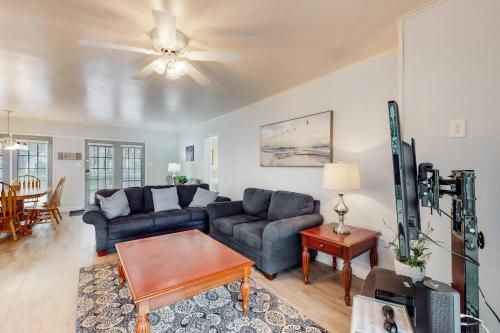 a living room with a couch and a table at Drawbridge Rd 38 in Ocean Pines
