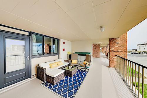 a living room with a couch and a table at Colonial Unit 202 in Ocean City