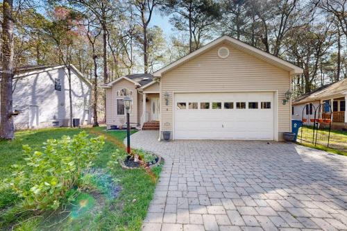 a house with a driveway and a garage at Trinity Place Treasure in Ocean Pines