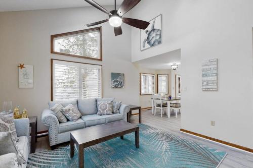 a living room with a couch and a ceiling fan at Trinity Place Treasure in Ocean Pines